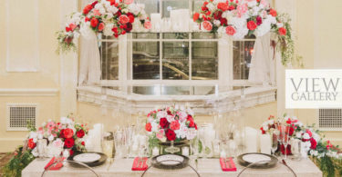 Valentine's Wedding Table Setting With Red Florals