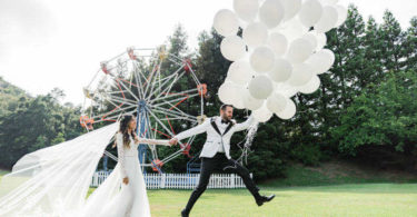 Bride and groom with balloons