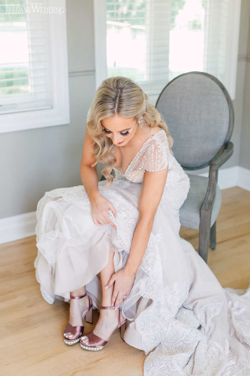 bride putting on her wedding shoes fairytale wedding