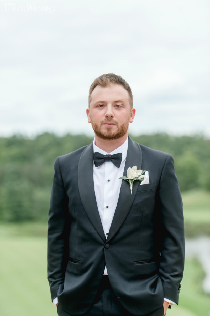 groom in a black tuxedo