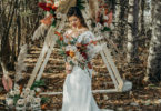 rustic wedding ceremony with a boho arch