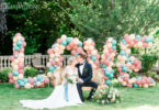 bride and groom in a garden wedding with Love Balloons