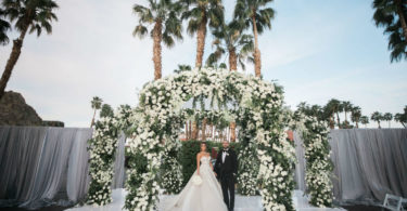 green and white floral arch