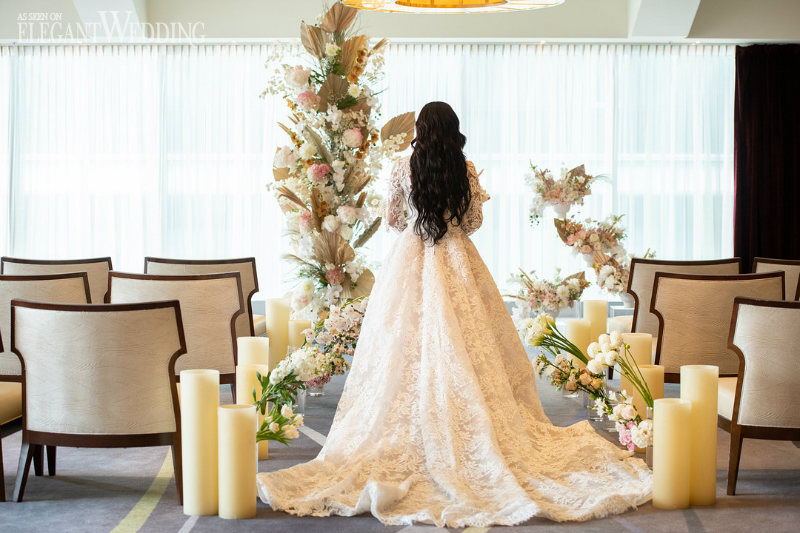 wedding ceremony with bride and the back of the wedding dress