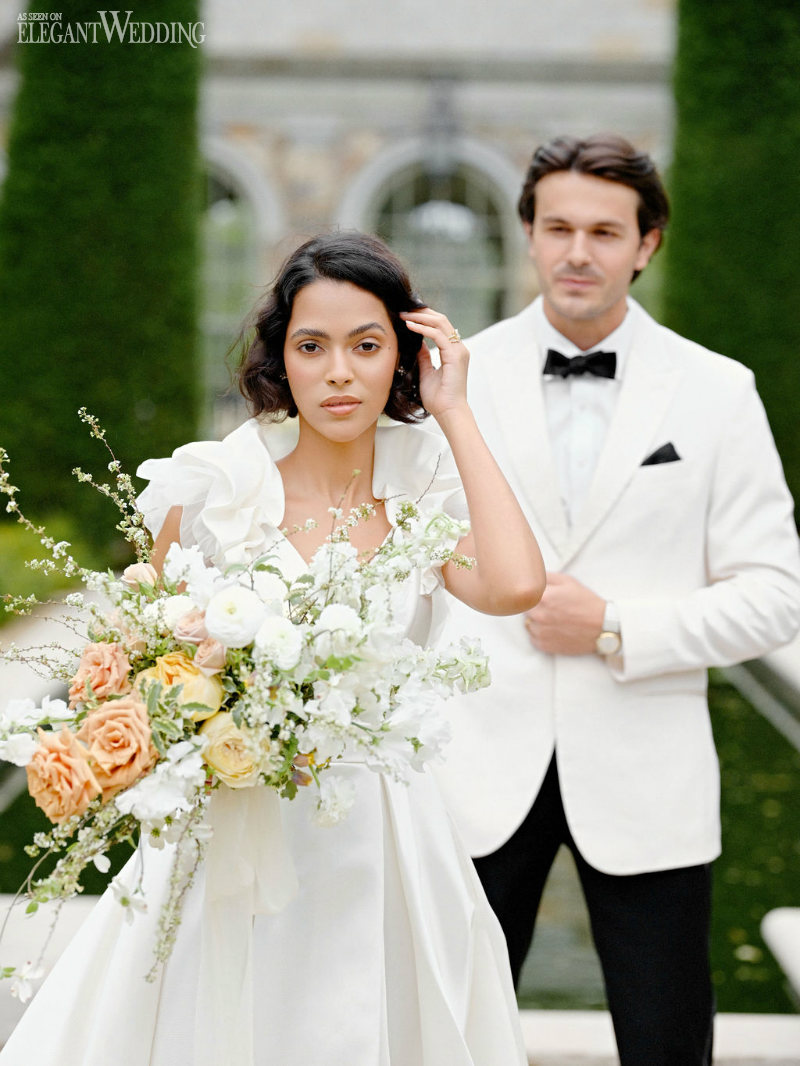 bride wearing wona holding a romantic traditional bouquet