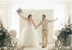 whimsical wedding ceremony with flower wall