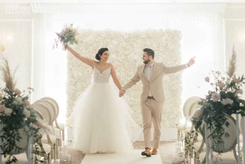 whimsical wedding ceremony with flower wall