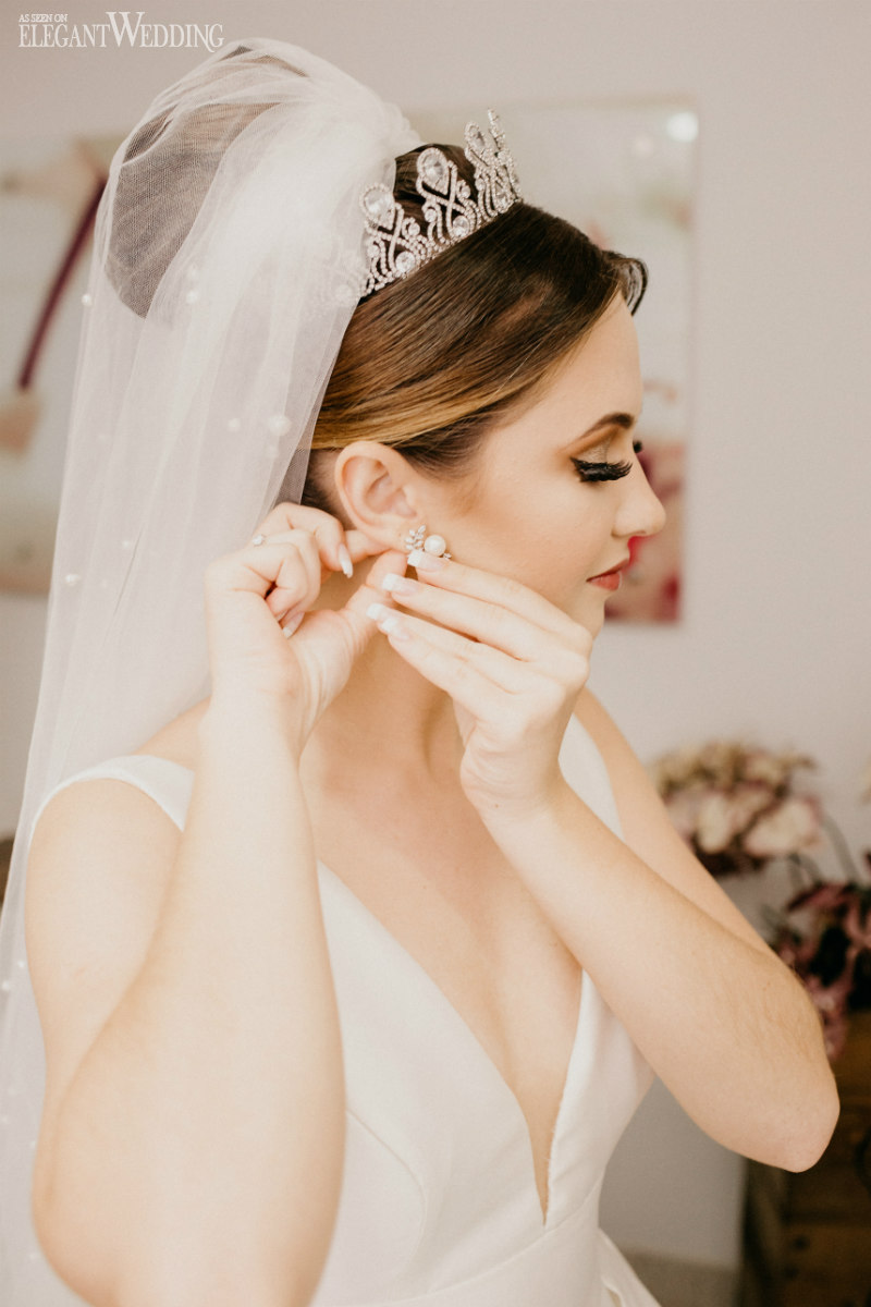 bride wearing diamond earings on her big day