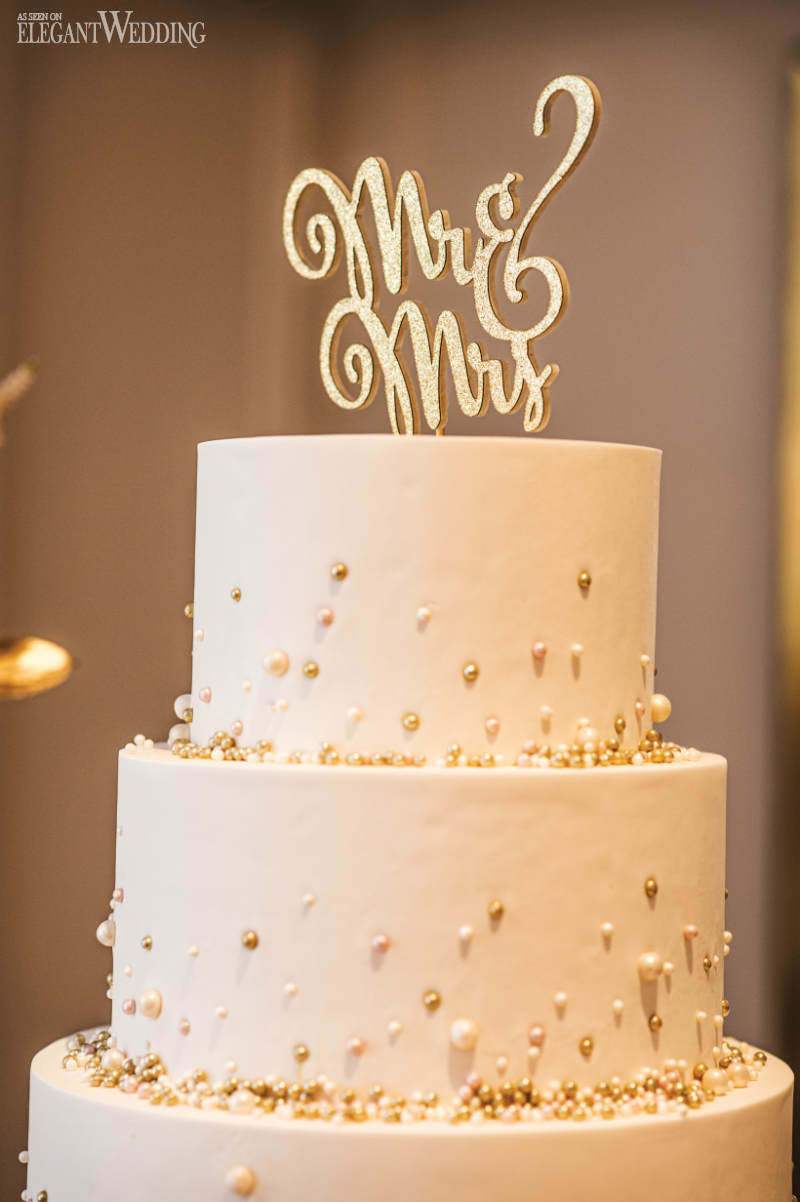 white wedding cake with Mr & Mrs topper