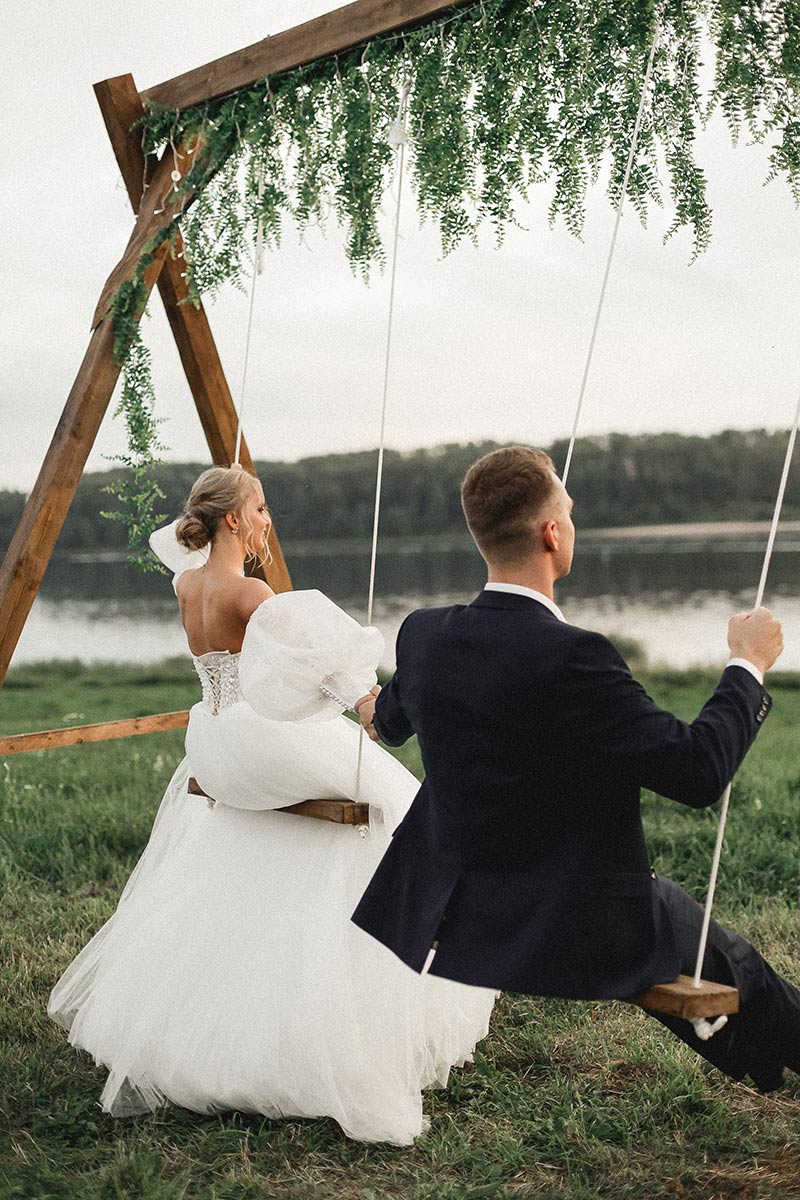 bride and groom on a swing