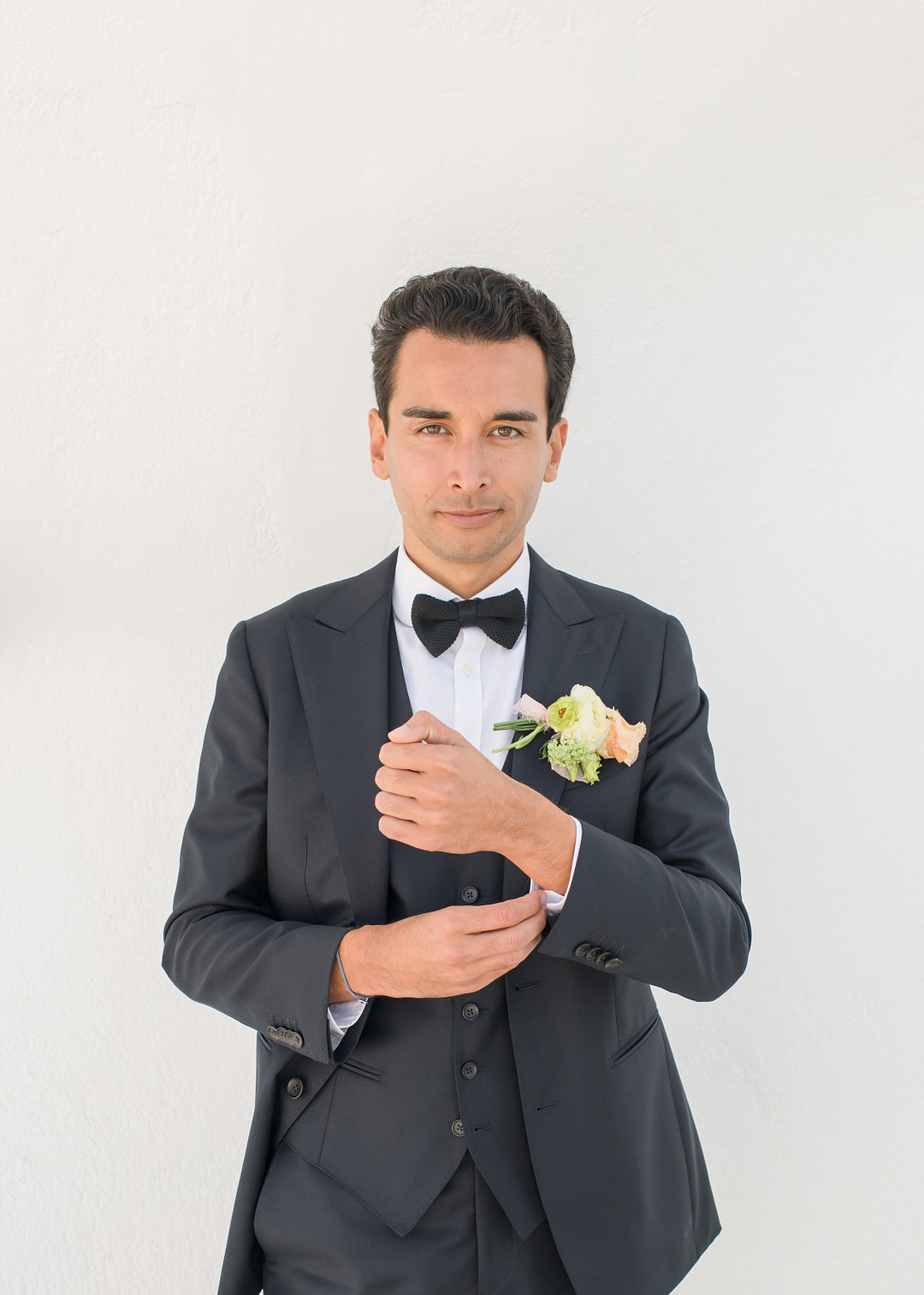 groom at a destination wedding in santorini