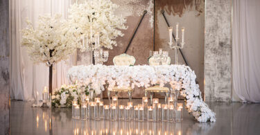 white glass table with flower cascading flowers