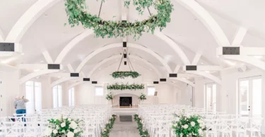 green and white wedding ceremony with hanging floral chandelier