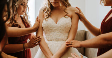 bride wearing glasses on her wedding day