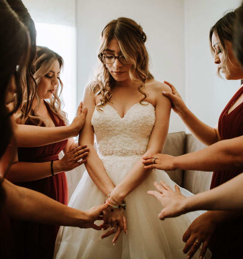 bride wearing glasses on her wedding day