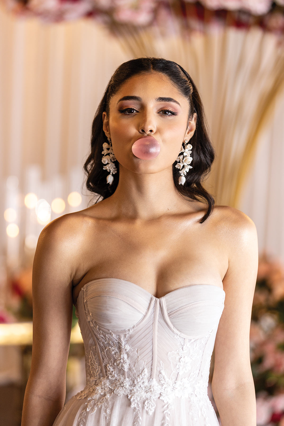 fun bride blowing a bubble from gum