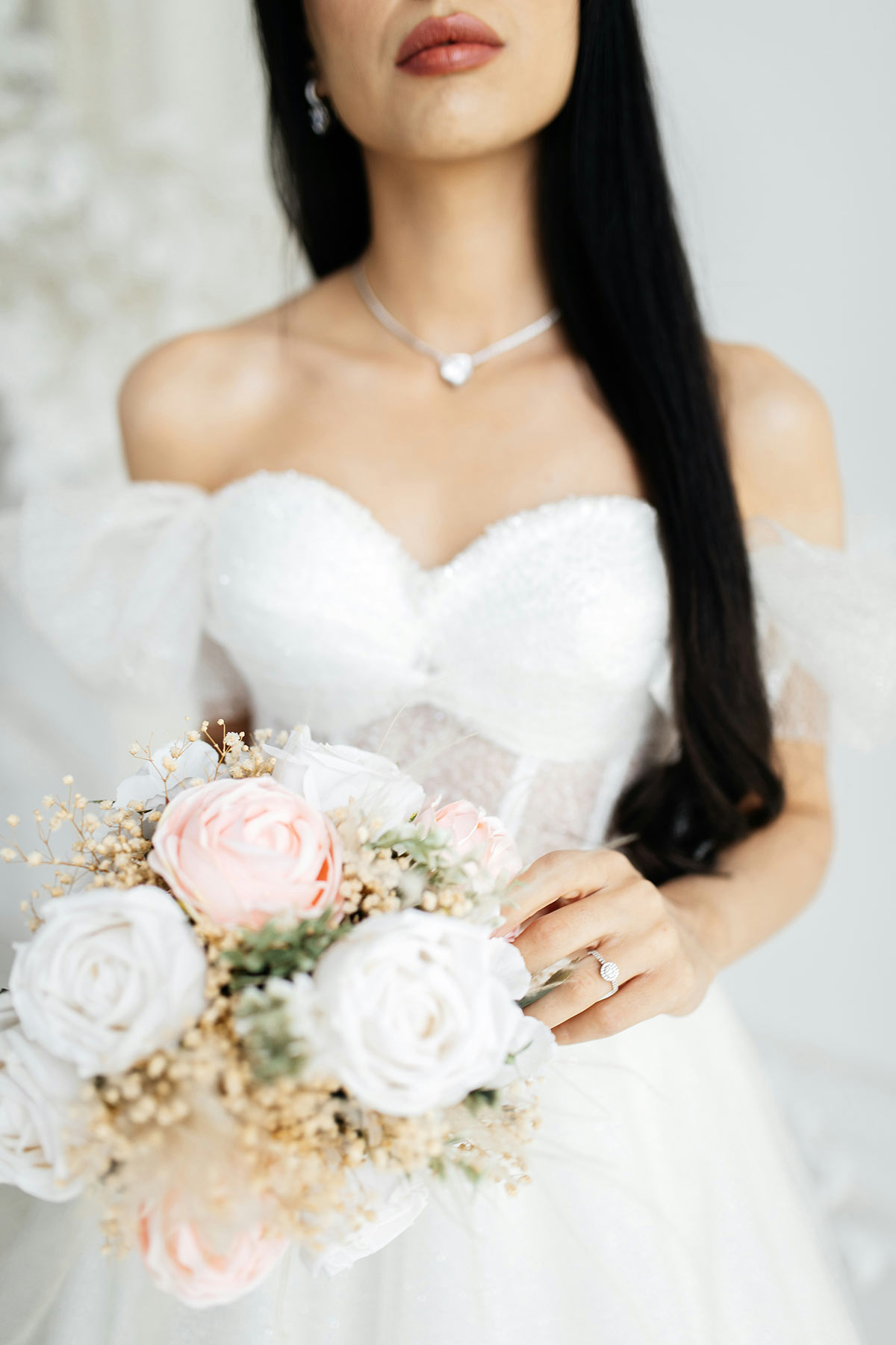 bride with custom jewelry for her wedding