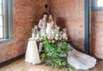 bride and groom with a white wedding cake