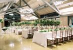 tall green and white floral arrangements for a wedding