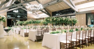 tall green and white floral arrangements for a wedding