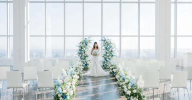 blue and white wedding ceremony with beautiful flowers