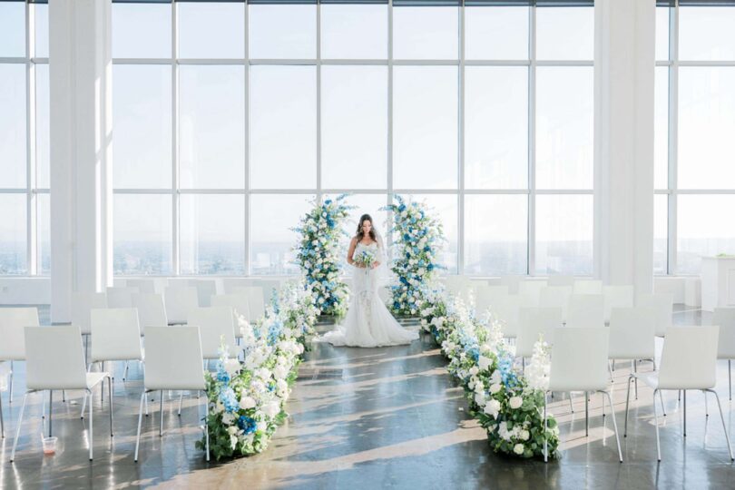 blue and white wedding ceremony with beautiful flowers