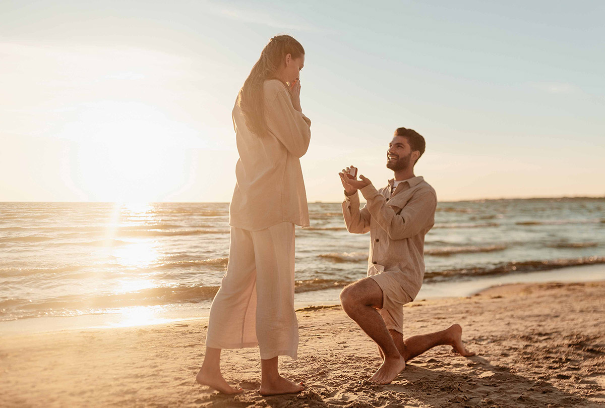 wedding proposal with a diamond ring that is pear cut